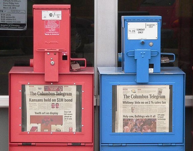 Two Columbus Telegram newspaper vending machines.